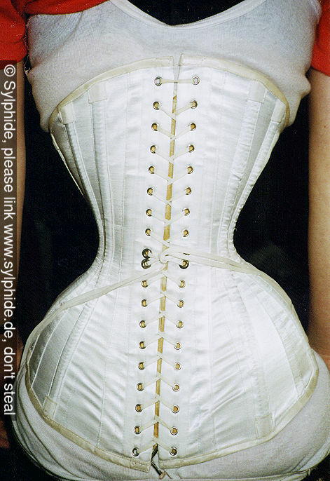 Satin corset 18 inch tightlaced to wasp waist with high compression of lower ribs (back) Sylphide figure training tight lacing corset laced wasp waist tightlaced